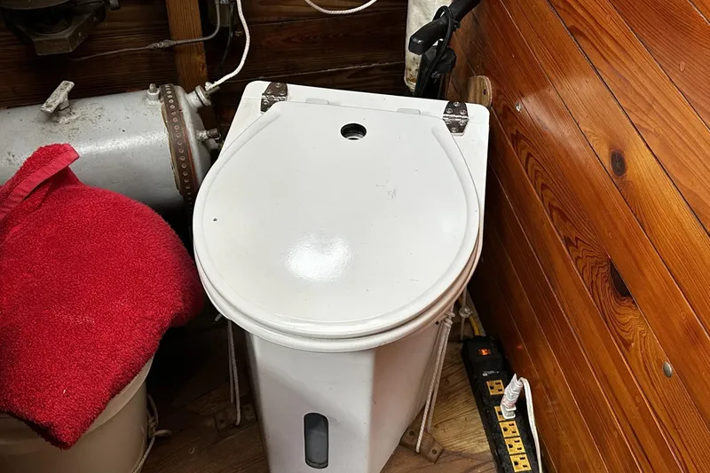 Slide: The Image of Compact marine toilet in wooden cabin of 2005 custom sail-assisted trawler. - 60