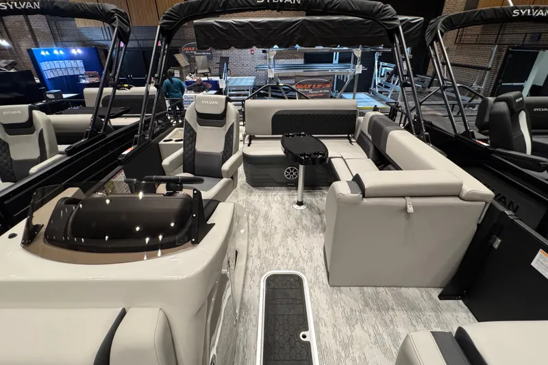 Slide: The Image of 2026 Sylvan L3 DLZ Bar pontoon boat interior with luxurious seating and modern design. - 5