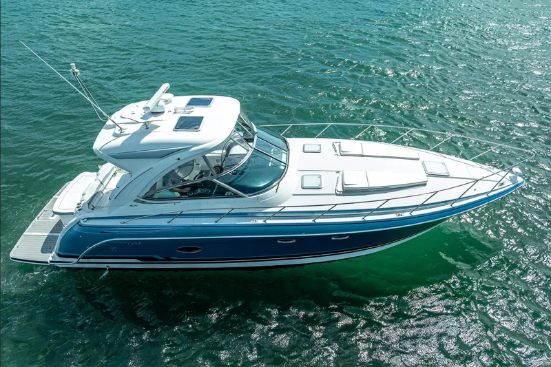 Slide: The Image of 2022 Formula 40 Performance Cruiser on clear blue water, aerial view. - 10