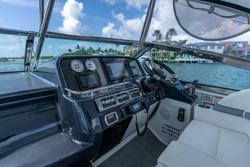 Slide: The Image of 2022 Formula 40 Performance Cruiser cockpit with modern navigation controls and luxurious seating. - 19