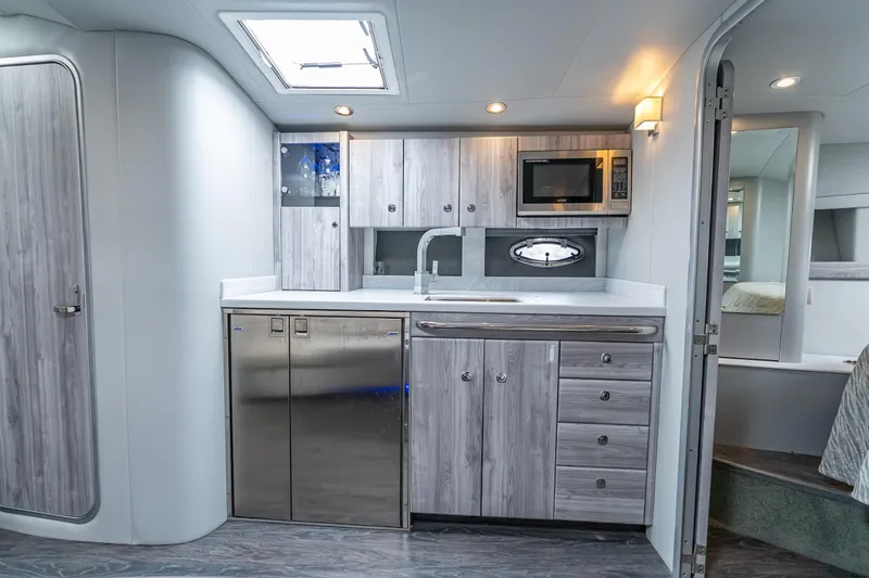 Slide: The Image of 2022 Formula 40 Performance Cruiser interior kitchen with modern appliances and sleek cabinetry. - 38