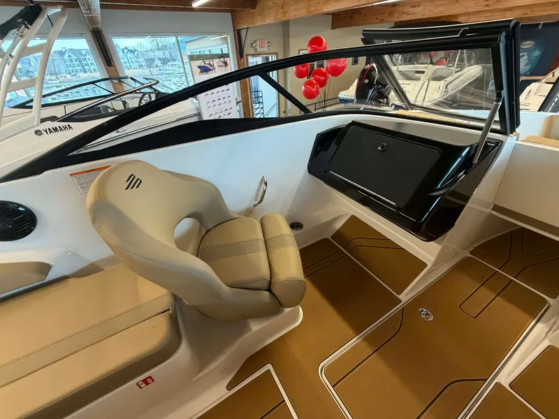 Slide: The Image of Interior of 2026 Bayliner V20 with beige seat and dashboard. - 11