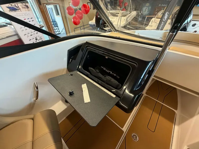 Slide: The Image of Interior view of Bayliner V20 2026 with open storage compartment. - 12
