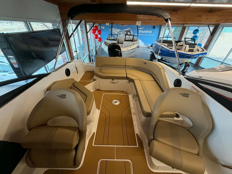 Slide: The Image of Interior of 2026 Bayliner V20 with beige seats and wood flooring. - 14