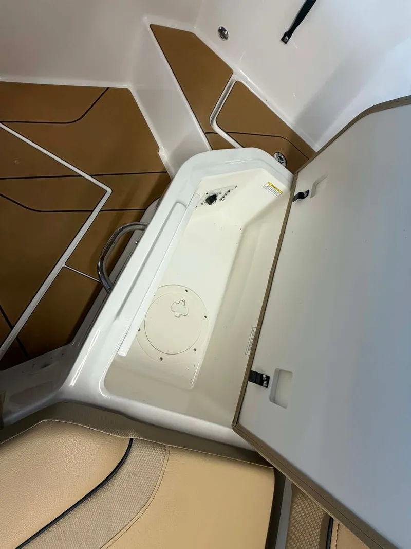 Slide: The Image of Open storage compartment in Bayliner V20 boat, 2026 model. - 16