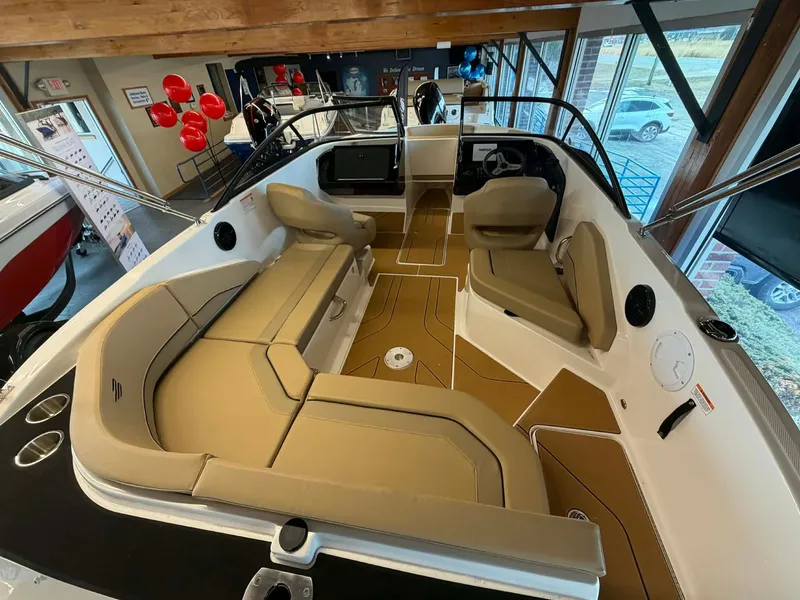 Slide: The Image of Interior view of 2026 Bayliner V20 with beige seating. - 6