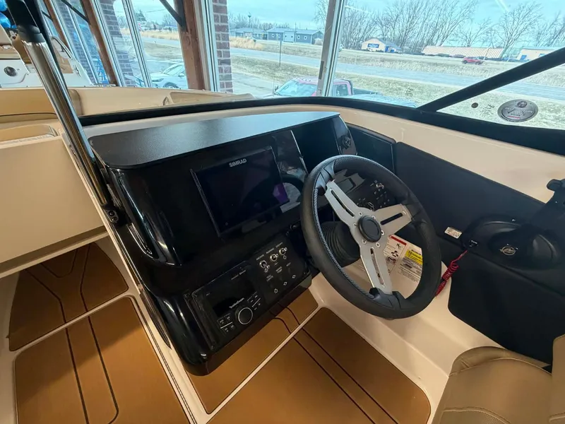 Slide: The Image of Interior view of 2026 Bayliner V20 cockpit with steering wheel and instruments. - 8