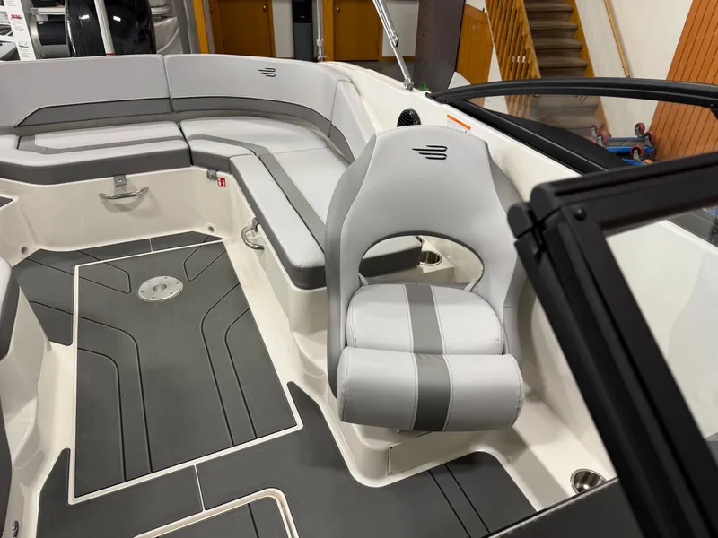 Slide: The Image of Interior of 2026 Bayliner V20 boat with gray upholstery. - 10