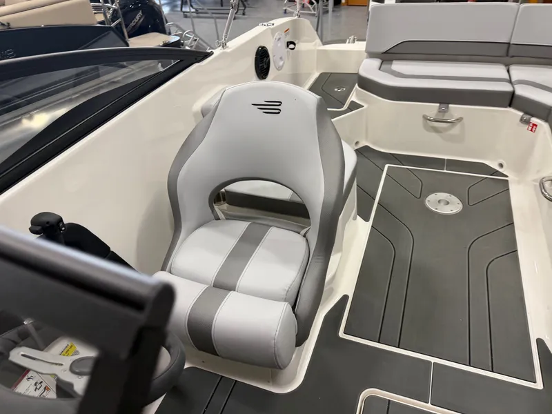 Slide: The Image of Interior of 2026 Bayliner V20 with gray seating and flooring. - 12