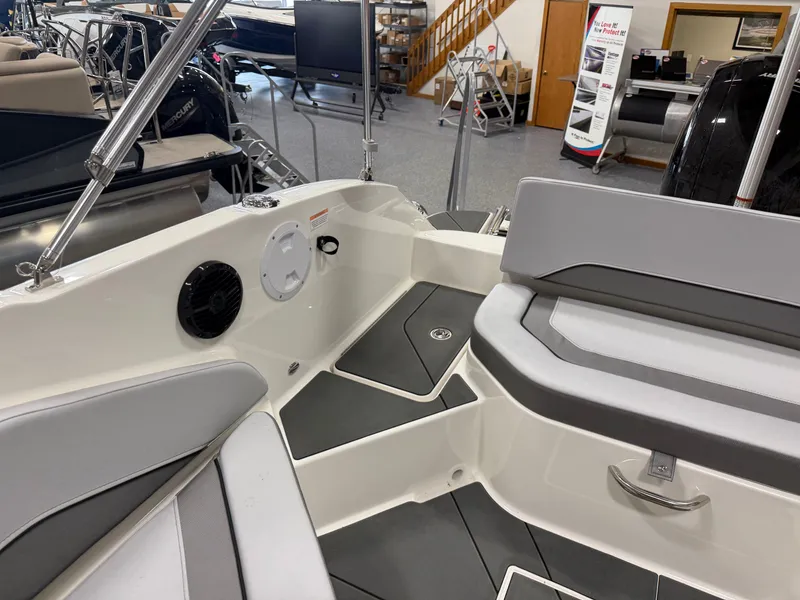 Slide: The Image of Interior of a 2026 Bayliner V20 boat in showroom. - 17