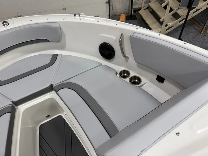 Slide: The Image of Interior of 2026 Bayliner V20 with gray seating and cup holders. - 7