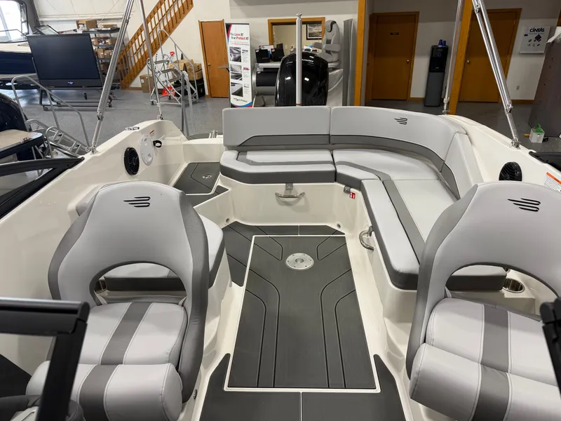 Slide: The Image of Interior of 2026 Bayliner V20 with gray seating and modern design. - 9
