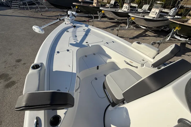 Slide: The Image of 2025 Sea Pro 230 Bay boat interior with seating and fishing equipment. - 14