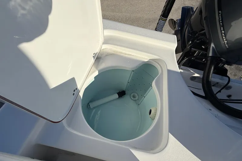 Slide: The Image of Open livewell on 2025 Sea Pro 230 Bay boat, showcasing interior design and functionality. - 24