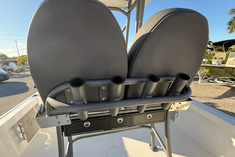 Slide: The Image of 2025 Sea Pro 230 Bay boat seating with rod holders and storage drawers. - 27