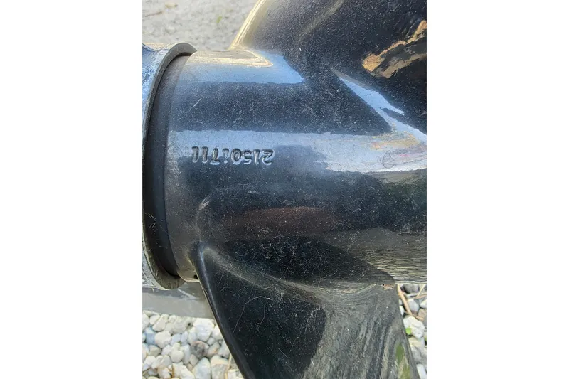 Slide: The Image of Close-up of a Robalo 2440 Walkaround 2001 boat propeller with serial number. - 11