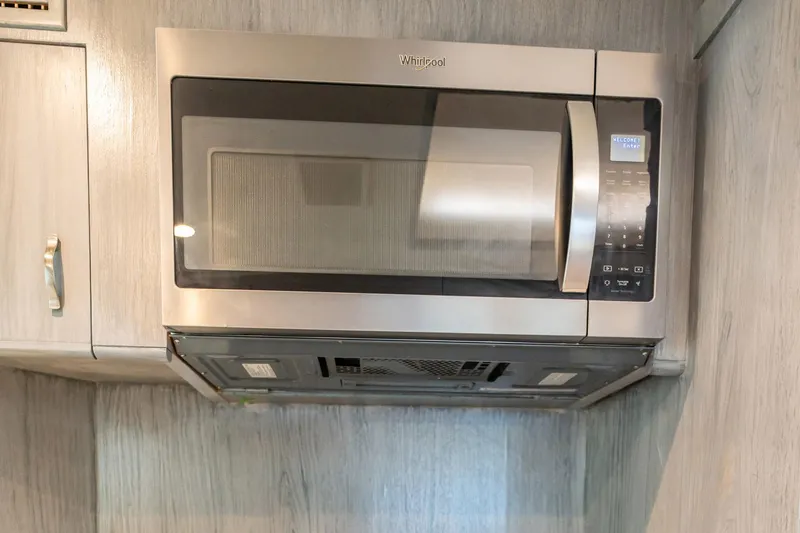 Slide: The Image of Stainless steel microwave in 1998 Hatteras 74 Cockpit Motor Yacht kitchen. - 14