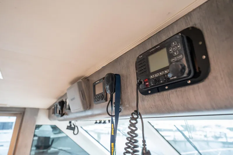 Slide: The Image of Interior electronics of 1998 Hatteras 74 Cockpit Motor Yacht, featuring communication equipment. - 19