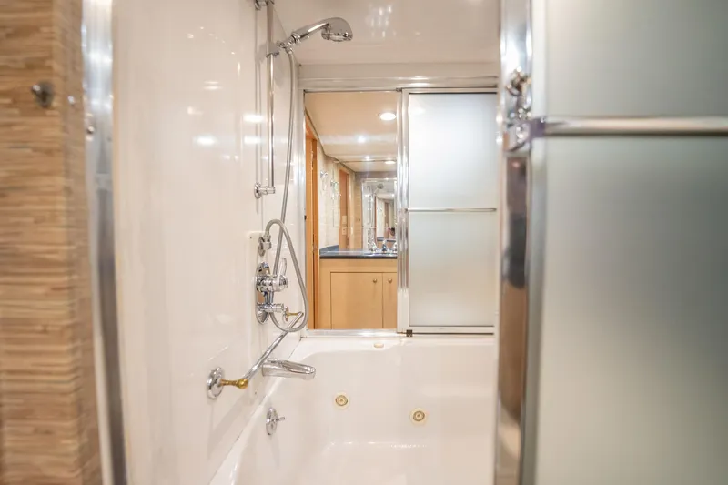 Slide: The Image of Luxurious bathroom in 1998 Hatteras 74 Cockpit Motor Yacht with modern fixtures. - 26