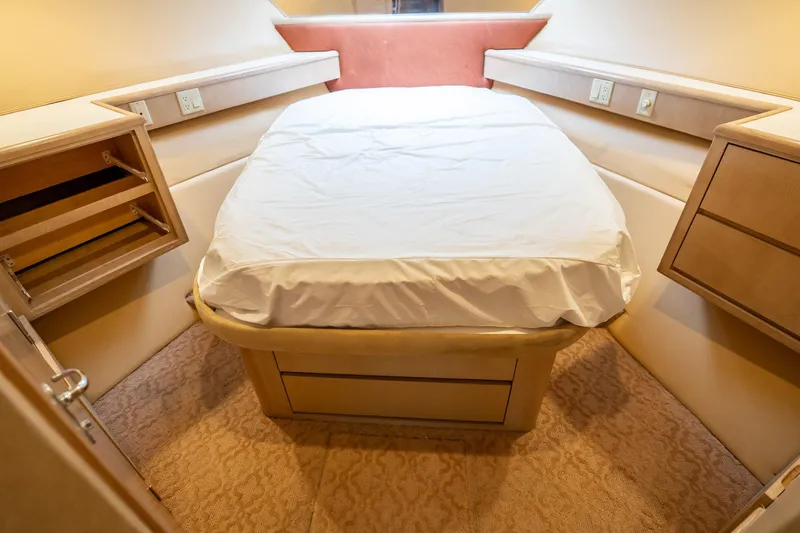 Slide: The Image of Bedroom interior of 1998 Hatteras 74 Cockpit Motor Yacht with cozy bed and storage. - 34