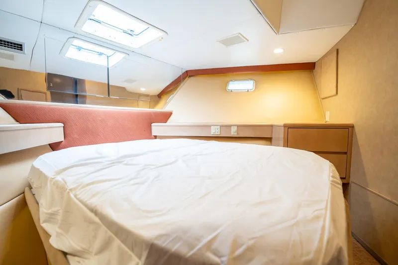 Slide: The Image of Interior cabin of 1998 Hatteras 74 Cockpit Motor Yacht with bed and skylight. - 35