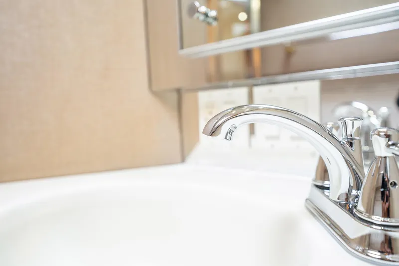 Slide: The Image of Chrome faucet in the bathroom of a 1998 Hatteras 74 Cockpit Motor Yacht. - 37