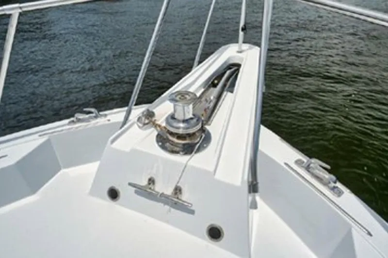Slide: The Image of Bow view of 1998 Hatteras 74 Cockpit Motor Yacht on water. - 39