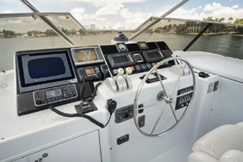 Slide: The Image of Cockpit of 1998 Hatteras 74 Cockpit Motor Yacht with navigation equipment and steering wheel. - 43