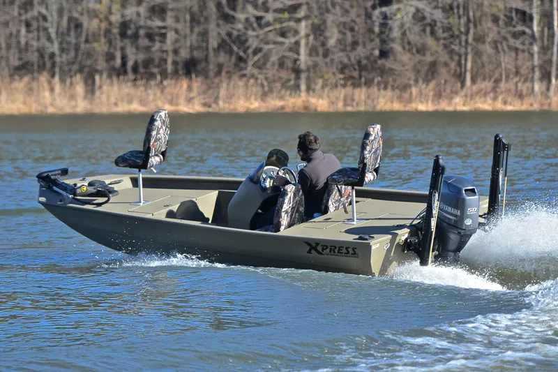 Slide: The Image of 2013 Express Xp170 boat cruising on a lake with Yamaha outboard motor. - 6