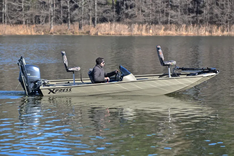 Slide: The Image of 2013 Express Xp170 boat on calm lake with Yamaha motor. - 7