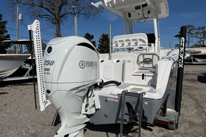 Slide: The Image of 2025 Sea Fox 228 Commander boat with Yamaha 250 V6 engine, parked outdoors. - 10