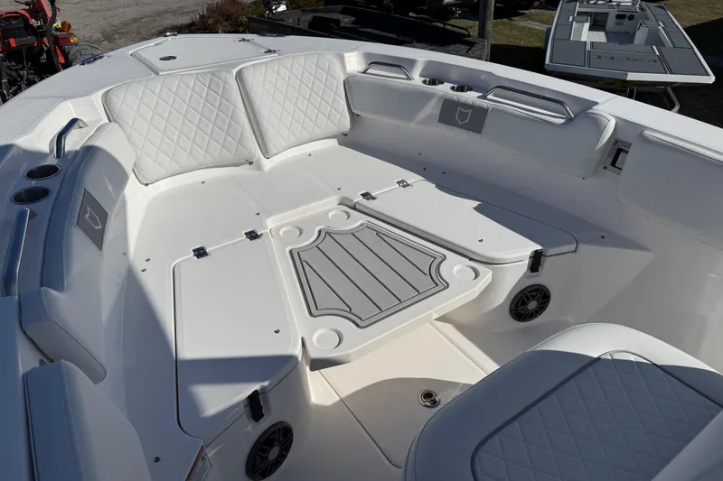 Slide: The Image of 2025 Sea Fox 228 Commander boat interior with cushioned seating and storage compartments. - 14
