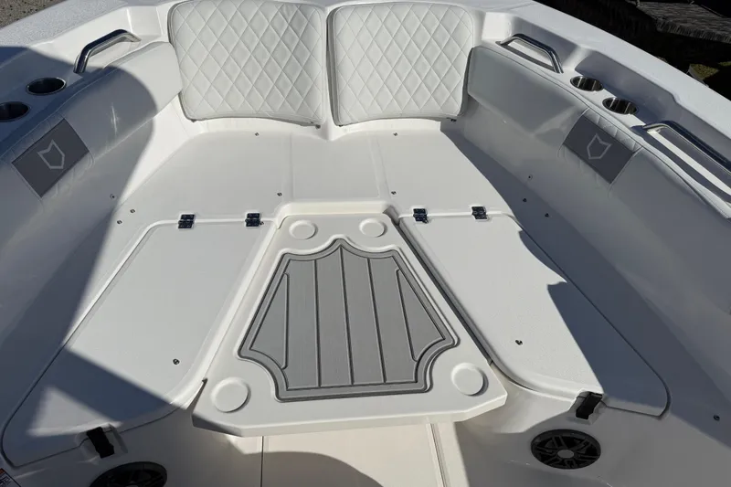 Slide: The Image of 2025 Sea Fox 228 Commander boat interior with cushioned seating and storage compartments. - 15