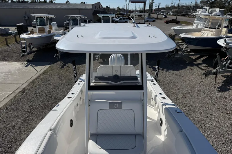 Slide: The Image of 2025 Sea Fox 228 Commander boat displayed in a dealership lot. - 17