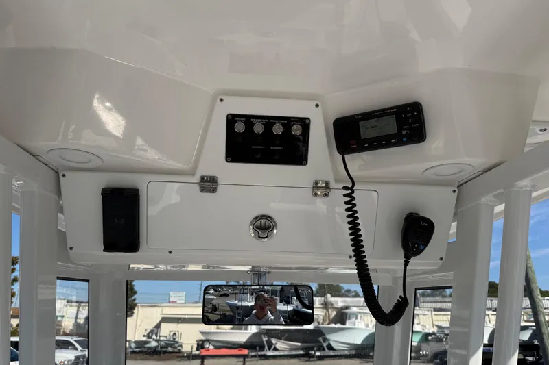 Slide: The Image of 2025 Sea Fox 228 Commander dashboard with radio and control panel. - 28