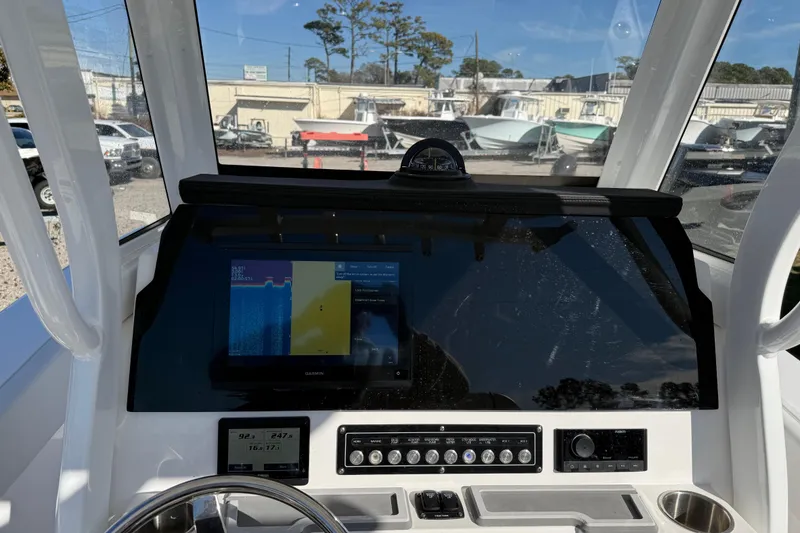 Slide: The Image of 2025 Sea Fox 228 Commander dashboard with navigation display and controls. - 30