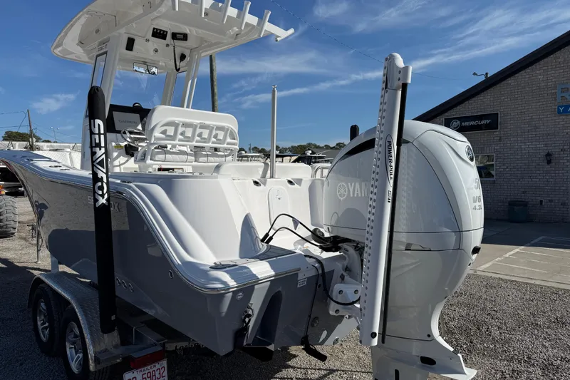 Slide: The Image of 2025 Sea Fox 228 Commander boat with Yamaha engine on trailer, outdoor display. - 7