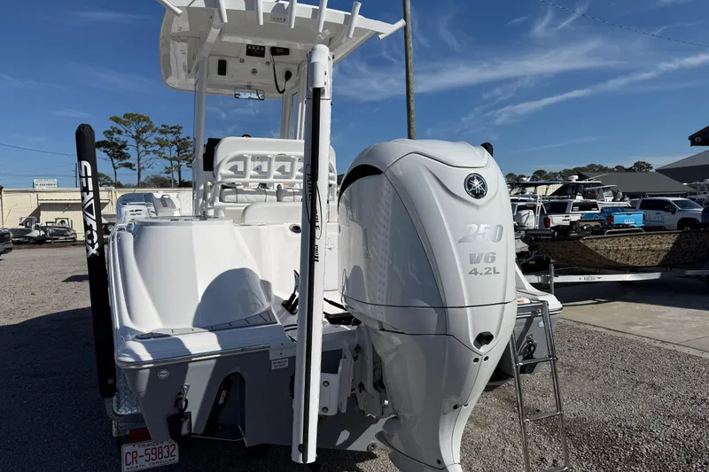 Slide: The Image of 2025 Sea Fox 228 Commander boat with Yamaha 250 V6 engine, parked outdoors. - 8