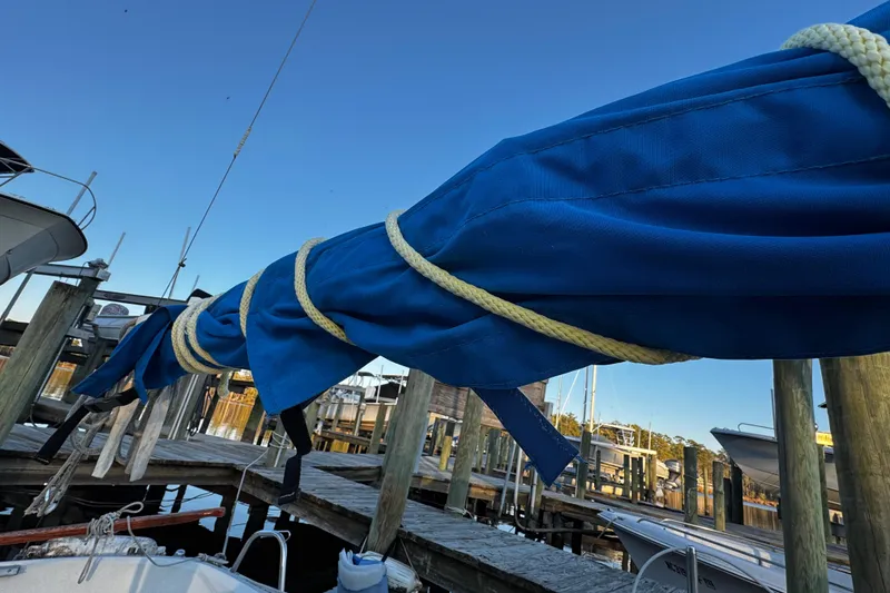 Slide: The Image of Blue sail cover on 1984 O'Day 222 boat docked at marina. - 24