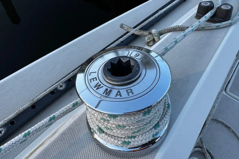 Slide: The Image of Winch on 1984 O'Day 222 sailboat deck with ropes and Lewmar branding. - 26