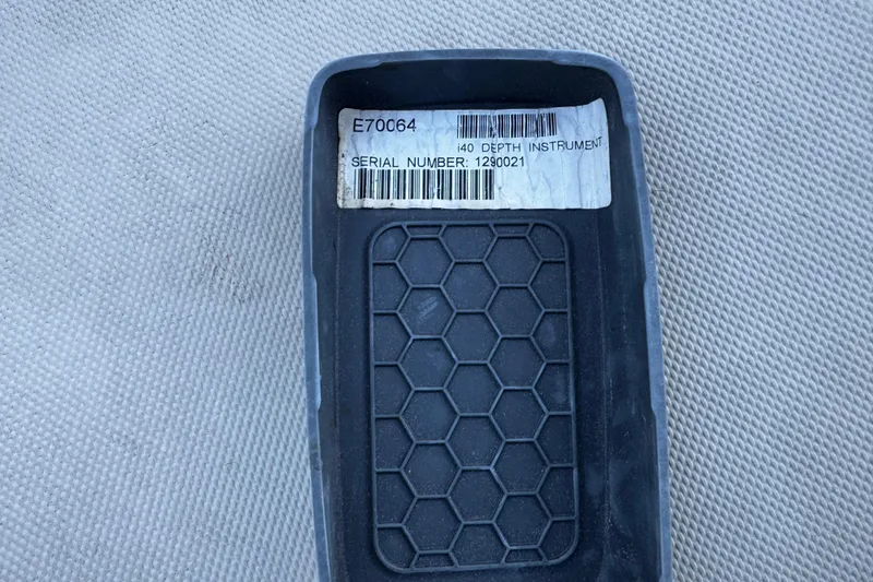 Slide: The Image of Hexagonal-patterned device with label, "i40 Depth Instrument," serial number 1290021, on textured surface. - 34