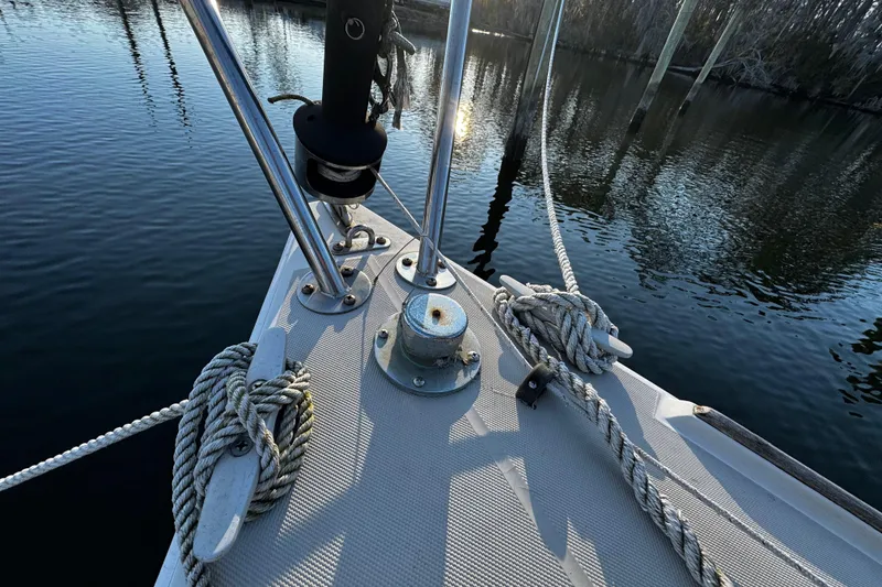 Slide: The Image of Bow of 1984 O'Day 222 sailboat with ropes and calm water reflection. - 37