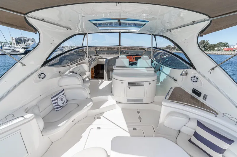 Slide: The Image of Luxurious 2004 Cruisers Yachts 540 Express interior with elegant seating and modern amenities. - 12