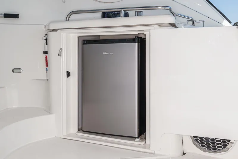 Slide: The Image of 2004 Cruisers Yachts 540 Express with built-in Hisense mini fridge. - 20