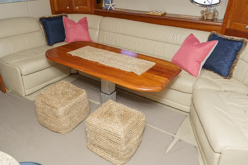 Slide: The Image of Luxurious 2004 Cruisers Yachts 540 Express interior with leather seating and wooden table. - 39