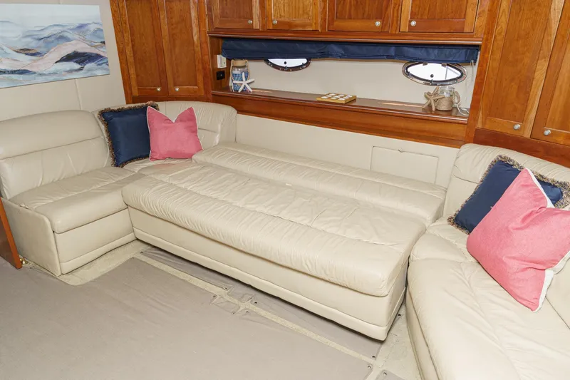 Slide: The Image of Luxurious interior of 2004 Cruisers Yachts 540 Express with beige leather seating and colorful cushions. - 45