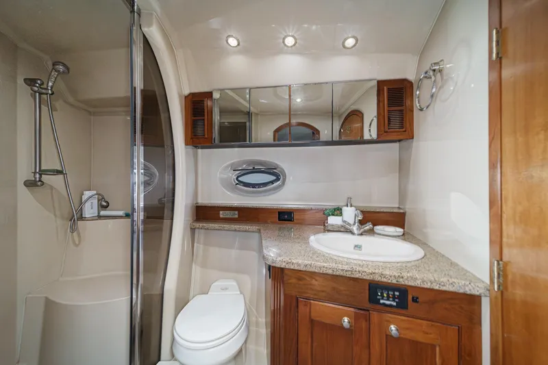 Slide: The Image of Luxurious bathroom in 2004 Cruisers Yachts 540 Express with shower and vanity. - 53
