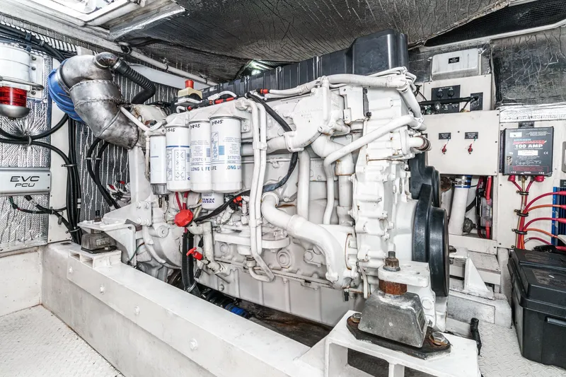 Slide: The Image of Engine room of 2004 Cruisers Yachts 540 Express, showcasing detailed mechanical components. - 63