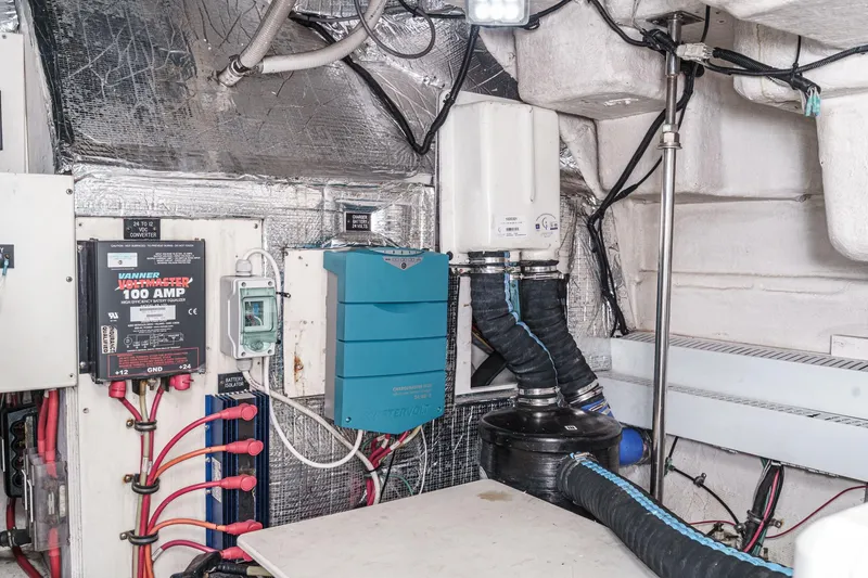 Slide: The Image of Engine room of 2004 Cruisers Yachts 540 Express with electrical components and wiring. - 65