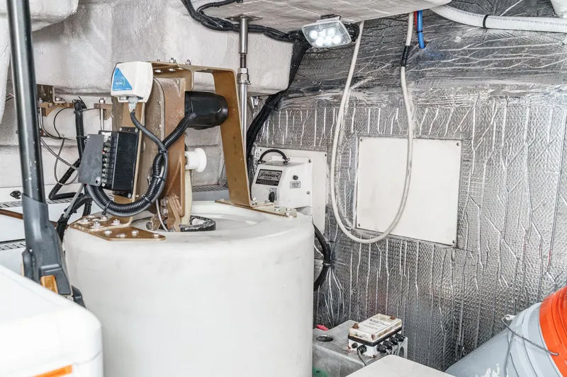 Slide: The Image of Engine room of 2004 Cruisers Yachts 540 Express with equipment and wiring. - 66